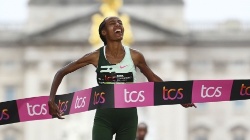 Hassan crosses the finish line at the London Marathon. 