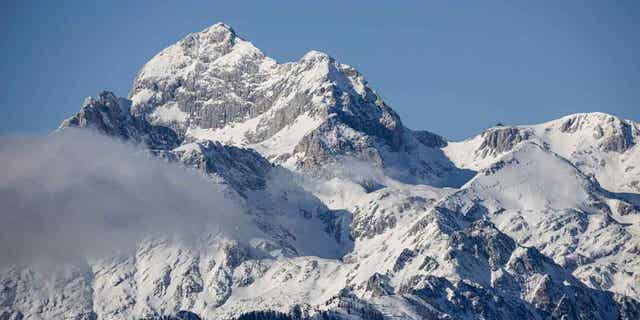 Slovenia's highest mountain is pictured from the road to the Soriska planina AlpVenture ski resort. Slovenia's emergency mountain rescue teams rescued four French citizens who were stuck in the Alps during bad weather.