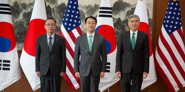 From left to right, Japanese nuclear envoy Takehiro Funakoshi, chief South Korean nuclear negotiator Kim Gunn, and the U.S. special representative to North Korea Sung Kim pose together before their three-way meeting in Seoul, South Korea, on April 7, 2023. 