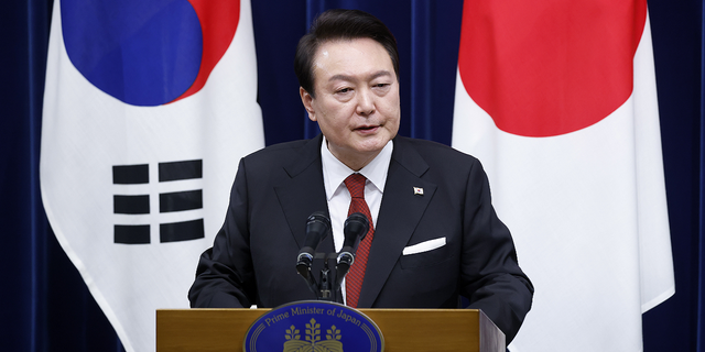 South Korean President Yoon Suk Yeol joins Japanese Prime Minister Fumio Kishida for a joint press conference after their meeting in Tokyo on March 16, 2023.