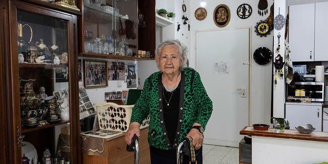 Holocaust survivor Tova Gutstein, 90, who lived in the Warsaw Ghetto as a child, poses for a photo at her apartment in Israel, on April 9, 2023. 