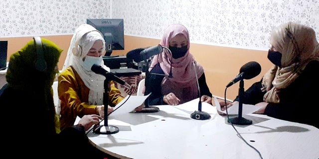 Najia Sorosh head of Sadai Banowan a women-run radio station, right, speaks with her Staff in the broadcasting studio in Badakhshan province, north-eastern of Afghanistan, Tuesday, Mar. 7, 2023.