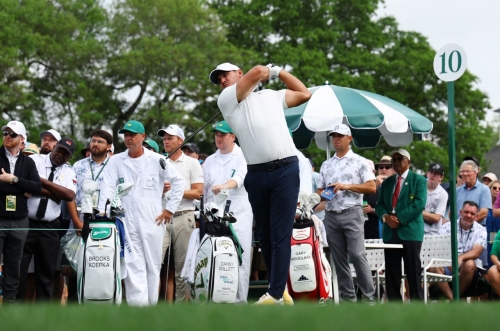 Brooks Koepka tees off on the 10th hole Friday. He is 12 under par heading into the weekend.