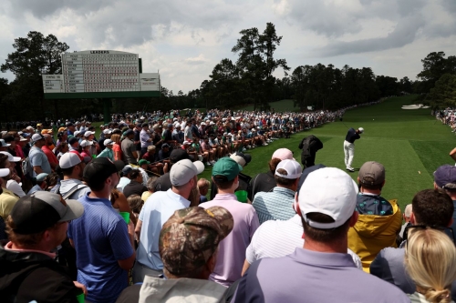 Woods tees off on the eighth hole Friday.