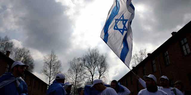 The annual March of the Living, a walk between two former Nazi death camps, to mourn victims of the Holocaust and celebrate the existence of the Jewish state is shown in Oswiecim, Poland, on April 18, 2023. 