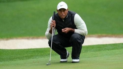 Tiger Woods lines up a putt on the 16th hole during the second round at Augusta. 