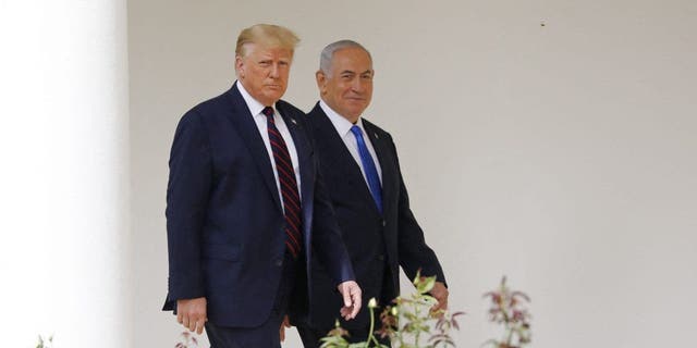Benjamin Netanyahu, Israel's prime minister, right, and President Donald Trump arrive for the Abraham Accords signing ceremony at the White House on Sept. 15, 2020.