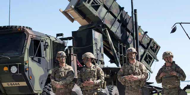 Members of US 10th Army Air and Missile Defense Command stands next to a Patriot surface-to-air missile battery during an exercise at the Siauliai airbase east of the capital Vilnius, Lithuania, on July 20, 2017. Ukraine’s defense minister said on April 19, 2023, his country has received U.S-made Patriot surface-to-air guided missile systems.