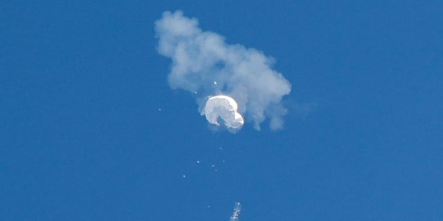 The Chinese spy balloon drifts to the ocean after being shot down off the coast in Surfside Beach, South Carolina, on Feb. 4, 2023.