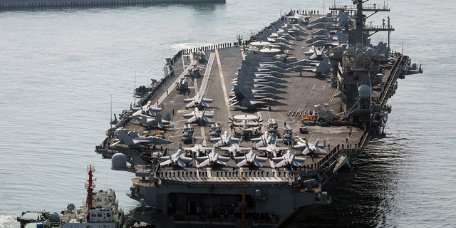 The aircraft carrier USS Nimitz is participating in drills with South Korea and Japan.