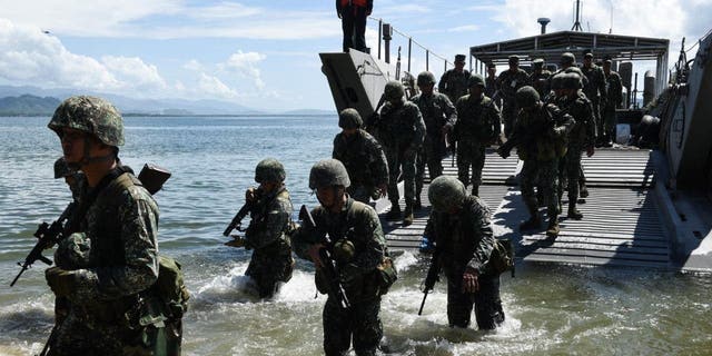 Philippine marines disembark from an amphibious landing craft in Casiguran Province, Philippines. Philippines and U.S. troops held the annual "Balikatan" (shoulder-to-shoulder) joint military exercises in 2017.