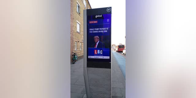 A billboard for U.K. radio station LBC with the latest news on Donald Trump's indictment.