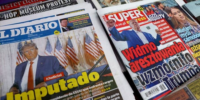 International newspapers are displayed at a newsstand following former President Donald Trump's indictment by a Manhattan grand jury in New York City, March 31, 2023.