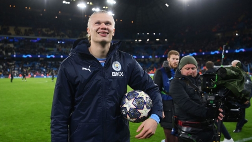 Haaland holds the match ball after scoring five against RB Leipzig in the Champions League in March. 