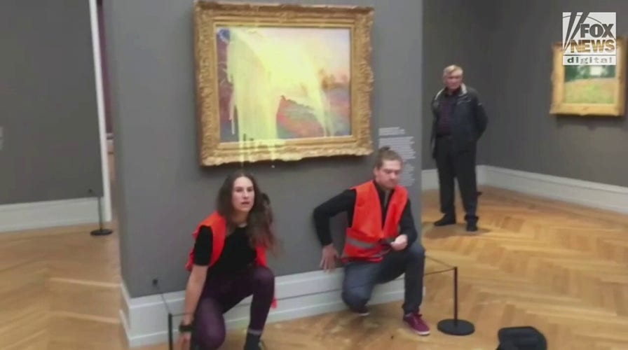German climate change protesters throw mashed potatoes on Monet painting