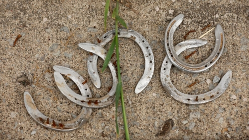 Discarded horse shoes in the barn area during the morning training for the Kentucky Derby at Churchill Downs on April 29, 2023. 