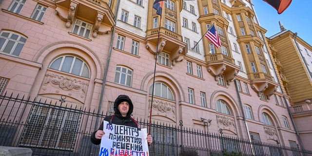 American embassy in Moscow with Russian protester outside