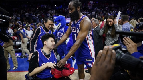 Philadelphia 76ers' James Harden gives his sneakers to John Hao after Game 4 against the Boston Celtics. 