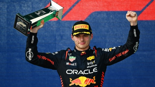 Max Verstappen celebrates on the podium after winning the Miami Grand Prix. 