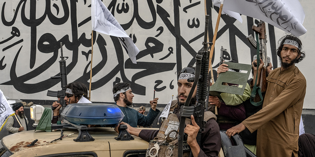 Taliban fighters in truck with guns