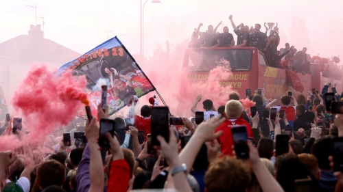 Three buses carrying staff and players from the men's and women's teams drove slowly through the town. 