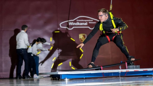 Steudtner stands on a surfboard at the Porsche Development Centre in Weissach, just outside Stuttgart. 