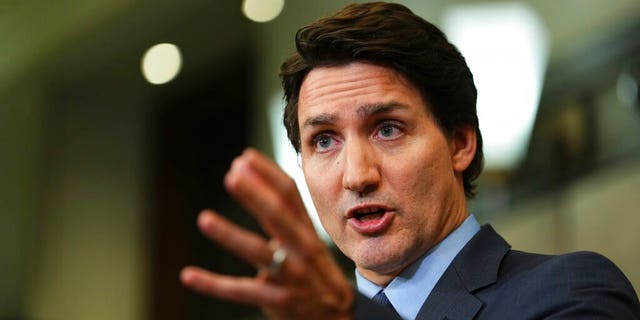 Justin Trudeau gesturing with left hand