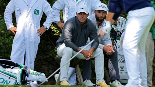 Koepka and Rahm wait by the 2nd tee during the final round of The Masters at Augusta National.