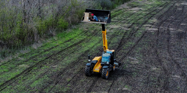 Ukraine tractor clearing mines is remote controlled