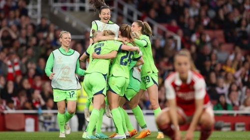 Wolfburg's players celebrate Pauline Bremer's winning goal against Arsenal.
