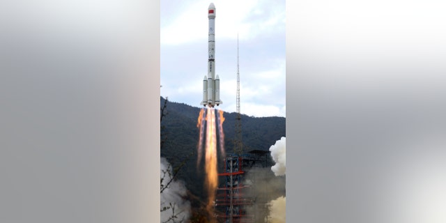 A Chinese rocket is seen blasting off in Xichang, China