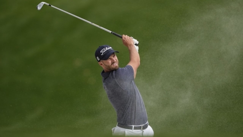 Clark escapes a bunker during the final round.