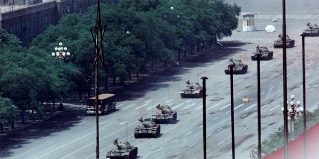 A man blocking tanks