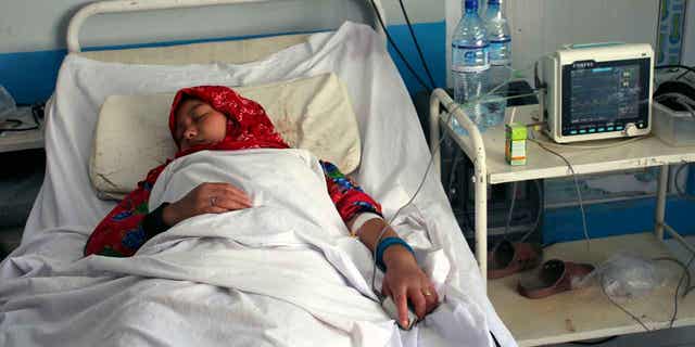 An Afghan schoolgirl receives treatment