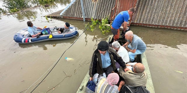 a photo of Kherson residents in boats