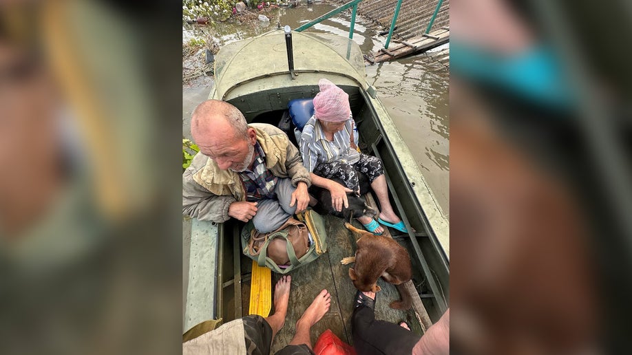 a photo of a Ukrainian man and woman fleeing in a boat