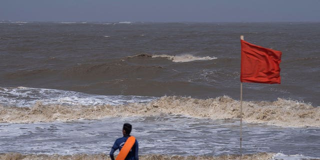 Man looks at sea in Mumbai