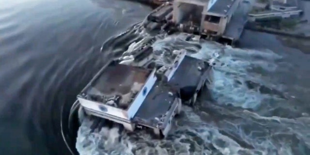 Floodwaters rush through buildings in southern Ukraine