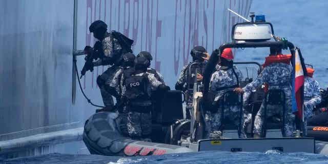 Armed Philippine Coast Guard personnel 
