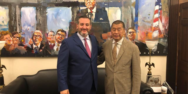 Jimmy Lai posing for a photo.
