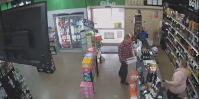 Man returns alcohol to cashier