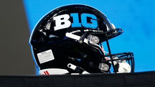 A B1G helmet sits on stage during the Big Ten Conference Media Days on July 27, 2023, at Lucas Oil Stadium in Indianapolis, Indiana. The conference is adding Oregon and Washington for the 2024 college football season, it announced Friday. 