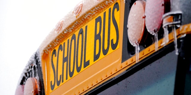 closeup show of school bus with icicles hanging off lights