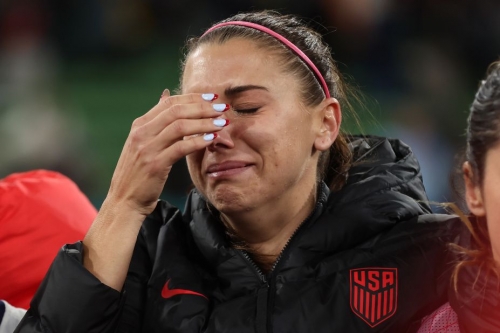 Alex Morgan cries after USA was knocked out of the tournament after a penalty shoot out loss to Sweden.
