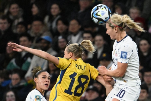 US midfielder Lindsey Horan, right, heads the ball as Sweden forward Fridolina Rolfo challenges during the last-16 tie at Melbourne Rectangular Stadium. 
