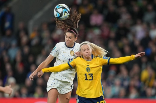 Alex Morgan of the United States goes up for a header with Amanda Ilestedt.