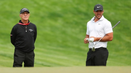 ROCHESTER, NEW YORK - MAY 16: Coach Pete Cowen and Brooks Koepka of the United States stand on the ninth hole during a practice round prior to the 2023 PGA Championship at Oak Hill Country Club on May 16, 2023 in Rochester, New York. (Photo by Kevin C. Cox/Getty Images)