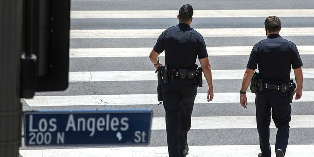 Los Angeles police walking on street