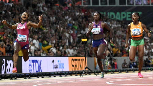 US sprinter Sha'Carri Richardson crosses the finish line in the women's 100-meter final during the World Athletics Championships in Budapest, Hungary, on August 21, 2023. 