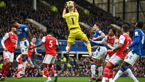 Arsenal's English goalkeeper Aaron Ramsdale jumps to catch the ball during the English Premier League football match between Everton and Arsenal at Goodison Park in Liverpool, north-west England, on February 4, 2023. - RESTRICTED TO EDITORIAL USE. No use with unauthorized audio, video, data, fixture lists, club/league logos or 'live' services. Online in-match use limited to 120 images. An additional 40 images may be used in extra time. No video emulation. Social media in-match use limited to 120 images. An additional 40 images may be used in extra time. No use in betting publications, games or single club/league/player publications. (Photo by Paul ELLIS / AFP) / RESTRICTED TO EDITORIAL USE. No use with unauthorized audio, video, data, fixture lists, club/league logos or 'live' services. Online in-match use limited to 120 images. An additional 40 images may be used in extra time. No video emulation. Social media in-match use limited to 120 images. An additional 40 images may be used in extra time. No use in betting publications, games or single club/league/player publications. / RESTRICTED TO EDITORIAL USE. No use with unauthorized audio, video, data, fixture lists, club/league logos or 'live' services. Online in-match use limited to 120 images. An additional 40 images may be used in extra time. No video emulation. Social media in-match use limited to 120 images. An additional 40 images may be used in extra time. No use in betting publications, games or single club/league/player publications. (Photo by PAUL ELLIS/AFP via Getty Images)